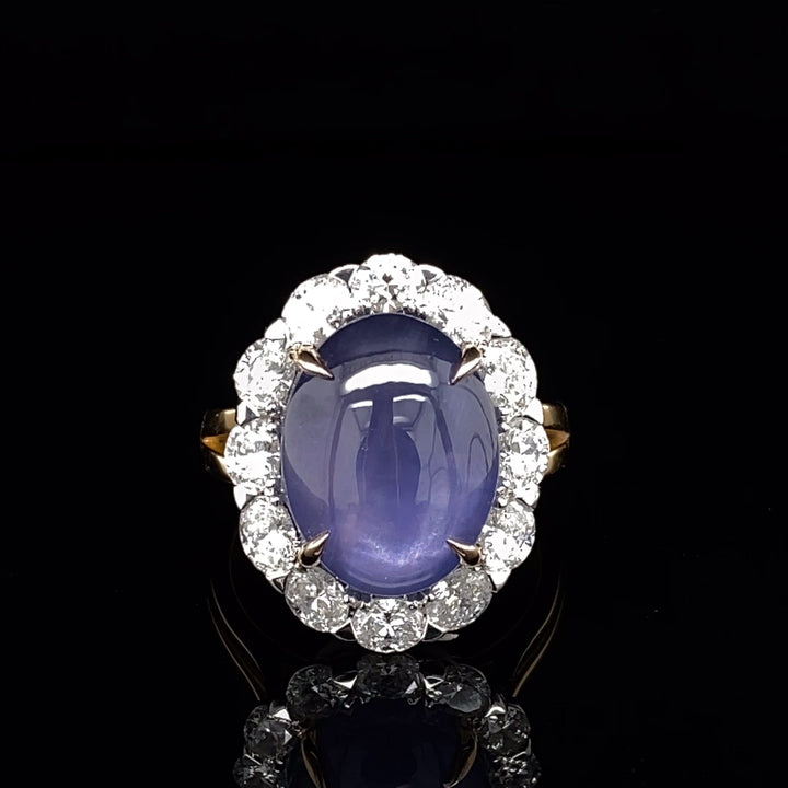 Oval cut cabochon star sapphire diamond halo ring on rose gold band