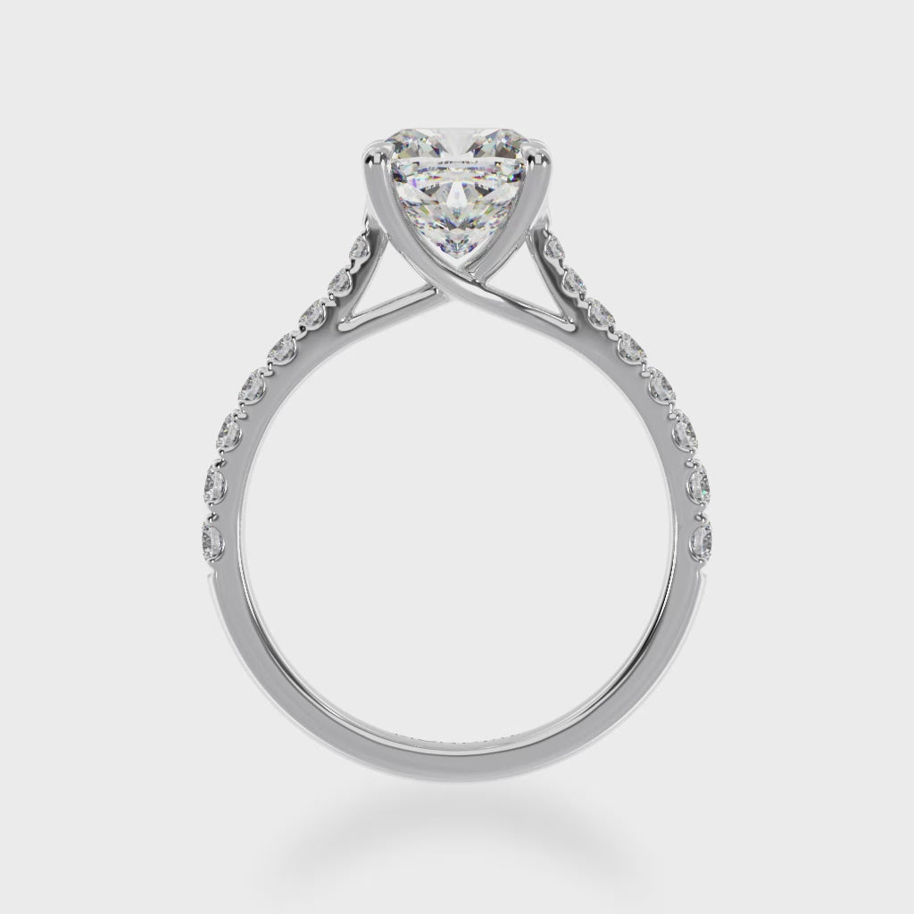 Cushion cut white diamond solitaire with a white gold claw set diamond band 3d view